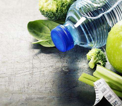A water bottled placed among vegetables