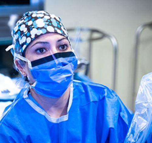 A surgeon standing in an operating room