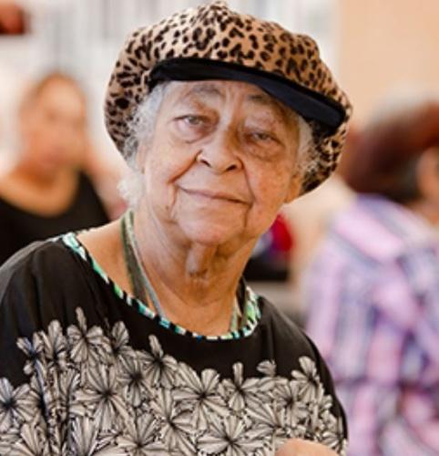 An elderly woman smiling