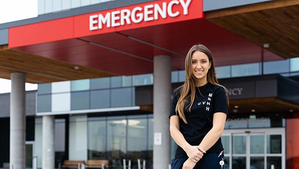 Olivia standing outside Cortellucci Vaughan Hospital, outside the Emergency Department