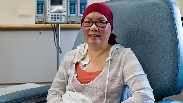 Sharon Tay sitting in a chair at the Chemo clinic